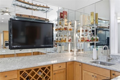 Experience elevated Florida living in this beautifully designed on Southern Woods Golf Club in Florida - for sale on GolfHomes.com, golf home, golf lot