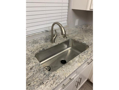 First-floor end unit in desirable Cross Creek Country Club - no on Cross Creek Country Club in Florida - for sale on GolfHomes.com, golf home, golf lot