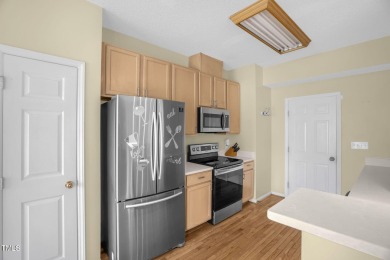 This beautifully updated home features a spacious living area on Hedingham Golf and Athletic Club in North Carolina - for sale on GolfHomes.com, golf home, golf lot