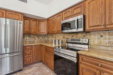 Nestled along a scenic double fairway in the heart of Ocotillo on Ocotillo Golf Resort  in Arizona - for sale on GolfHomes.com, golf home, golf lot