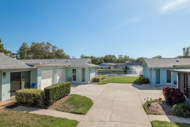 RARE OPPORTUNITY TO OWN A WATERFRONT CORNER VILLA NESTLED IN on Highland Lakes Executive Golf Course in Florida - for sale on GolfHomes.com, golf home, golf lot