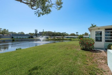 RARE OPPORTUNITY TO OWN A WATERFRONT CORNER VILLA NESTLED IN on Highland Lakes Executive Golf Course in Florida - for sale on GolfHomes.com, golf home, golf lot