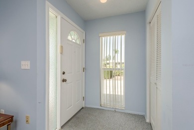 RARE OPPORTUNITY TO OWN A WATERFRONT CORNER VILLA NESTLED IN on Highland Lakes Executive Golf Course in Florida - for sale on GolfHomes.com, golf home, golf lot