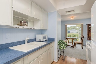 RARE OPPORTUNITY TO OWN A WATERFRONT CORNER VILLA NESTLED IN on Highland Lakes Executive Golf Course in Florida - for sale on GolfHomes.com, golf home, golf lot