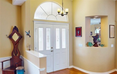 Experience refined Florida living in this meticulously on The Grand Club - Pine Lakes Course in Florida - for sale on GolfHomes.com, golf home, golf lot