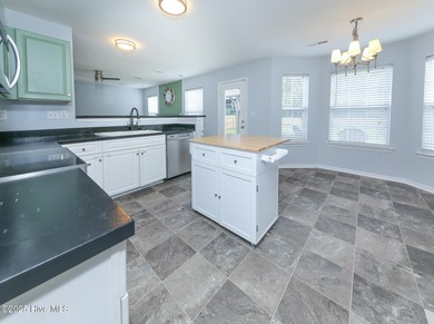 Welcome to this beautiful two- story 4 bedroom 2.5 bathroom home on Eagle Creek Golf Club and Grill in North Carolina - for sale on GolfHomes.com, golf home, golf lot