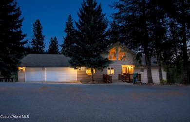 As you step outside, the serene lake surroundings take center on Ponderosa Springs Golf Course in Idaho - for sale on GolfHomes.com, golf home, golf lot