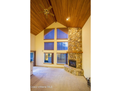 As you step outside, the serene lake surroundings take center on Ponderosa Springs Golf Course in Idaho - for sale on GolfHomes.com, golf home, golf lot