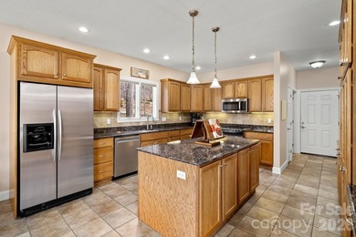 Perched on a gentle hill with sweeping views of the 7th and 9th on Cummings Cove Golf and Country Club in North Carolina - for sale on GolfHomes.com, golf home, golf lot