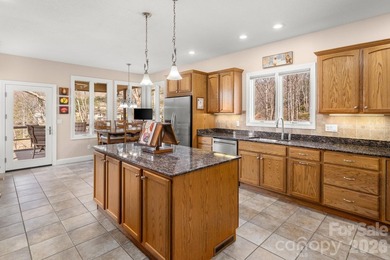 Perched on a gentle hill with sweeping views of the 7th and 9th on Cummings Cove Golf and Country Club in North Carolina - for sale on GolfHomes.com, golf home, golf lot