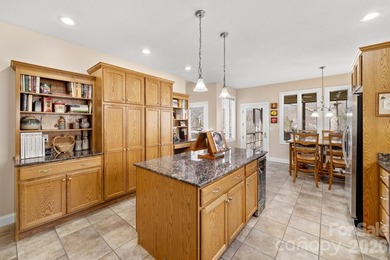 Perched on a gentle hill with sweeping views of the 7th and 9th on Cummings Cove Golf and Country Club in North Carolina - for sale on GolfHomes.com, golf home, golf lot