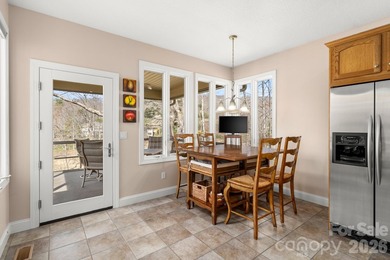 Perched on a gentle hill with sweeping views of the 7th and 9th on Cummings Cove Golf and Country Club in North Carolina - for sale on GolfHomes.com, golf home, golf lot