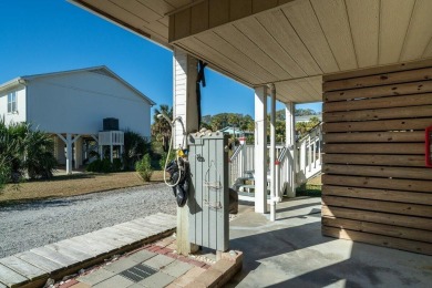 Meticulously maintained Edisto cottage fronting on a saltwater on The Plantation Course At Edisto in South Carolina - for sale on GolfHomes.com, golf home, golf lot