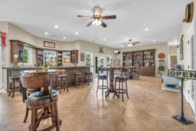 LAKEFRONT RETREAT on The Patriot Golf Club At Grand Harbor in South Carolina - for sale on GolfHomes.com, golf home, golf lot