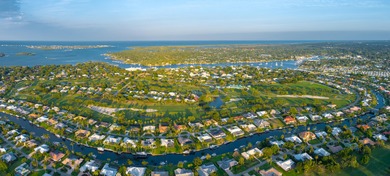 Stunning waterfront top-down remodel in the sought-after Yacht & on Yacht and Country Club in Florida - for sale on GolfHomes.com, golf home, golf lot