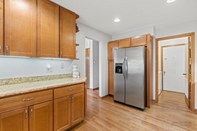 Welcome to this exceptional two-story end unit, perfectly on Poplar Creek Country Club in Illinois - for sale on GolfHomes.com, golf home, golf lot