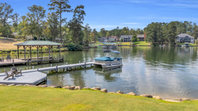 LAKEFRONT RETREAT on The Patriot Golf Club At Grand Harbor in South Carolina - for sale on GolfHomes.com, golf home, golf lot