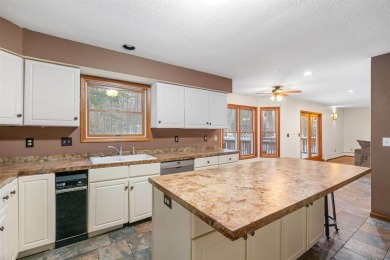 Discover the perfect blend of privacy and convenience in this on Charlevoix Golf and Country Club in Michigan - for sale on GolfHomes.com, golf home, golf lot