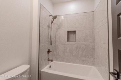 Experience refined living in this stunning 4-bedroom, 3-bath on San Juan Country Club in New Mexico - for sale on GolfHomes.com, golf home, golf lot