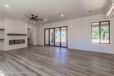 Experience refined living in this stunning 4-bedroom, 3-bath on San Juan Country Club in New Mexico - for sale on GolfHomes.com, golf home, golf lot