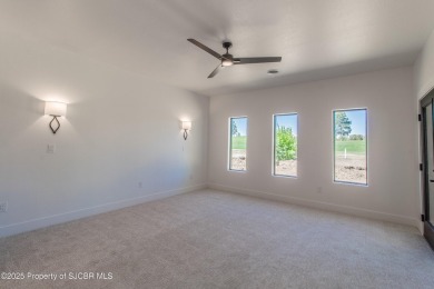 Experience refined living in this stunning 4-bedroom, 3-bath on San Juan Country Club in New Mexico - for sale on GolfHomes.com, golf home, golf lot
