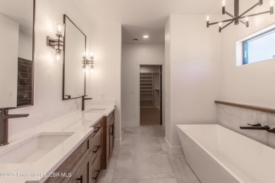 Experience refined living in this stunning 4-bedroom, 3-bath on San Juan Country Club in New Mexico - for sale on GolfHomes.com, golf home, golf lot