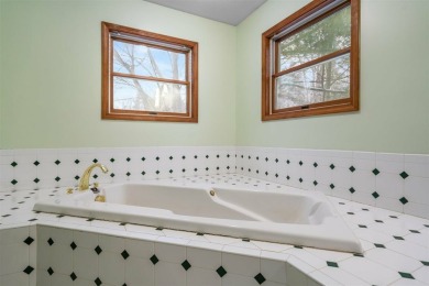 Discover the perfect blend of privacy and convenience in this on Charlevoix Golf and Country Club in Michigan - for sale on GolfHomes.com, golf home, golf lot