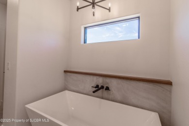 Experience refined living in this stunning 4-bedroom, 3-bath on San Juan Country Club in New Mexico - for sale on GolfHomes.com, golf home, golf lot