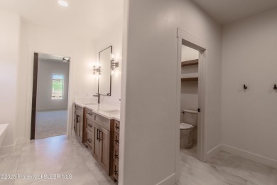 Experience refined living in this stunning 4-bedroom, 3-bath on San Juan Country Club in New Mexico - for sale on GolfHomes.com, golf home, golf lot
