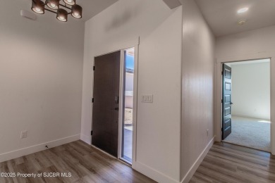 Experience refined living in this stunning 4-bedroom, 3-bath on San Juan Country Club in New Mexico - for sale on GolfHomes.com, golf home, golf lot