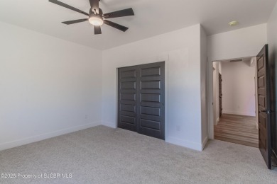 Experience refined living in this stunning 4-bedroom, 3-bath on San Juan Country Club in New Mexico - for sale on GolfHomes.com, golf home, golf lot