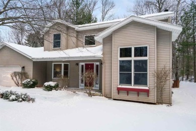 Discover the perfect blend of privacy and convenience in this on Charlevoix Golf and Country Club in Michigan - for sale on GolfHomes.com, golf home, golf lot