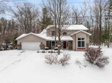 Discover the perfect blend of privacy and convenience in this on Charlevoix Golf and Country Club in Michigan - for sale on GolfHomes.com, golf home, golf lot