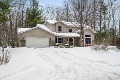 Discover the perfect blend of privacy and convenience in this on Charlevoix Golf and Country Club in Michigan - for sale on GolfHomes.com, golf home, golf lot