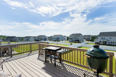 Enter the double gates and take in the beautifully landscaped on The Preserve At Jordan Lake Golf Club in North Carolina - for sale on GolfHomes.com, golf home, golf lot