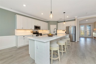 Under contract-accepting backup offers. This Summerville model on Lakewood National Golf Club in Florida - for sale on GolfHomes.com, golf home, golf lot