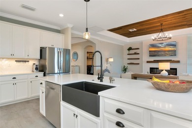 Under contract-accepting backup offers. This Summerville model on Lakewood National Golf Club in Florida - for sale on GolfHomes.com, golf home, golf lot