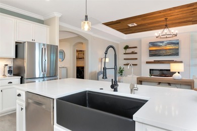 Under contract-accepting backup offers. This Summerville model on Lakewood National Golf Club in Florida - for sale on GolfHomes.com, golf home, golf lot