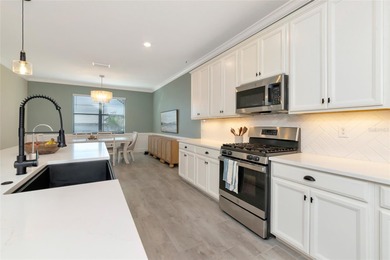 Under contract-accepting backup offers. This Summerville model on Lakewood National Golf Club in Florida - for sale on GolfHomes.com, golf home, golf lot