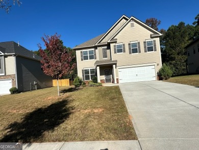 The spacious home features 5 bedrooms, 3 full baths, and a 2-car on Canongate At Heron Bay in Georgia - for sale on GolfHomes.com, golf home, golf lot