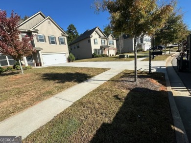 The spacious home features 5 bedrooms, 3 full baths, and a 2-car on Canongate At Heron Bay in Georgia - for sale on GolfHomes.com, golf home, golf lot