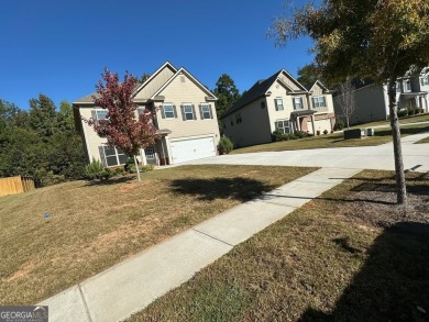 The spacious home features 5 bedrooms, 3 full baths, and a 2-car on Canongate At Heron Bay in Georgia - for sale on GolfHomes.com, golf home, golf lot