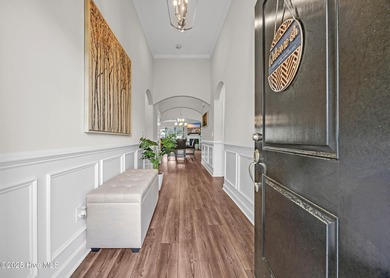 Experience refined coastal living in this rare Evans Park beauty on International Club of Myrtle Beach in South Carolina - for sale on GolfHomes.com, golf home, golf lot