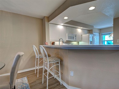 Enjoy peaceful canal views and Florida living at its finest in on Sabal Trace Golf and Country Club in Florida - for sale on GolfHomes.com, golf home, golf lot