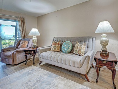 Enjoy peaceful canal views and Florida living at its finest in on Sabal Trace Golf and Country Club in Florida - for sale on GolfHomes.com, golf home, golf lot