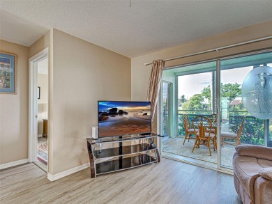 Enjoy peaceful canal views and Florida living at its finest in on Sabal Trace Golf and Country Club in Florida - for sale on GolfHomes.com, golf home, golf lot