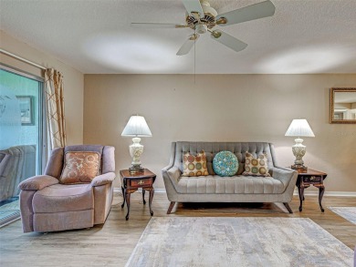 Enjoy peaceful canal views and Florida living at its finest in on Sabal Trace Golf and Country Club in Florida - for sale on GolfHomes.com, golf home, golf lot