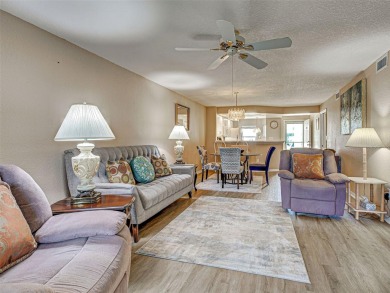 Enjoy peaceful canal views and Florida living at its finest in on Sabal Trace Golf and Country Club in Florida - for sale on GolfHomes.com, golf home, golf lot