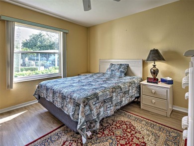Enjoy peaceful canal views and Florida living at its finest in on Sabal Trace Golf and Country Club in Florida - for sale on GolfHomes.com, golf home, golf lot