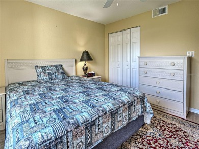 Enjoy peaceful canal views and Florida living at its finest in on Sabal Trace Golf and Country Club in Florida - for sale on GolfHomes.com, golf home, golf lot